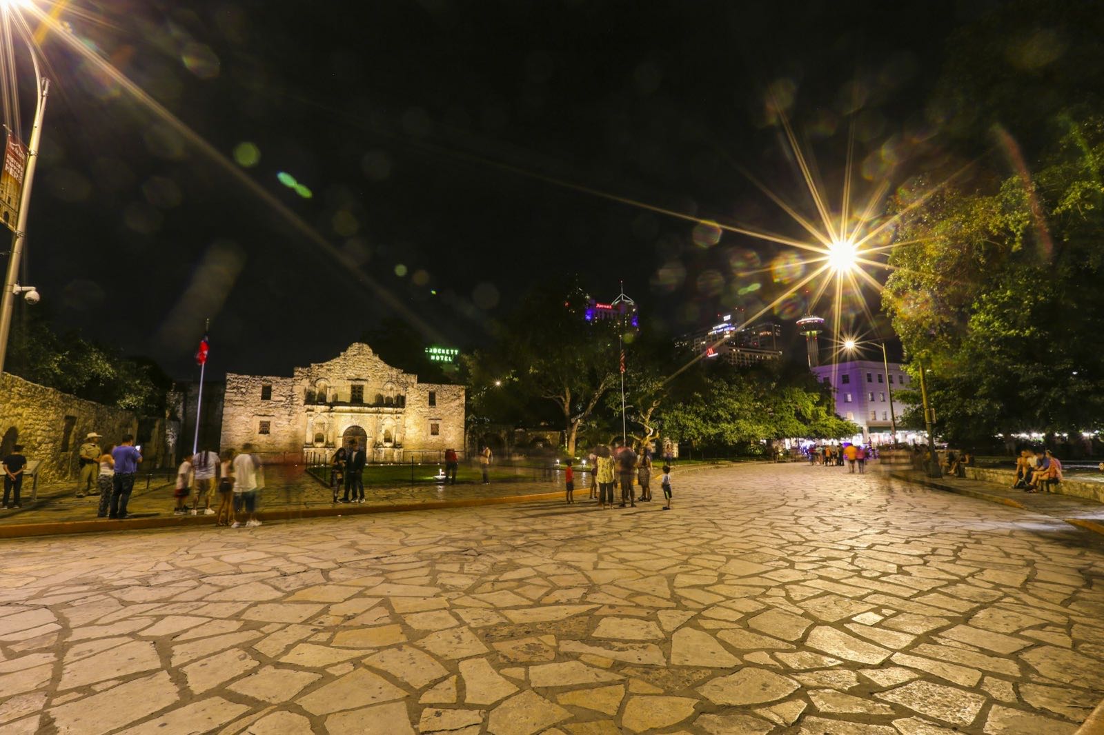 Alamo Plaza paving and lit downtown facades at night