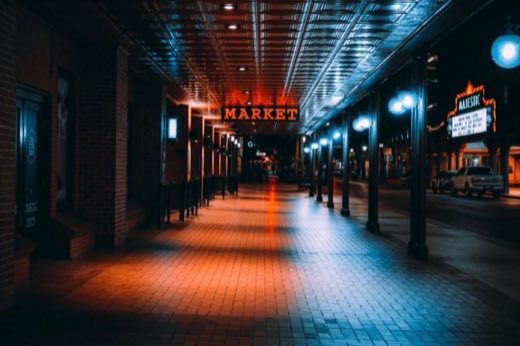 Covered sidewalk and theatre marquee on a downtown San Antonio street