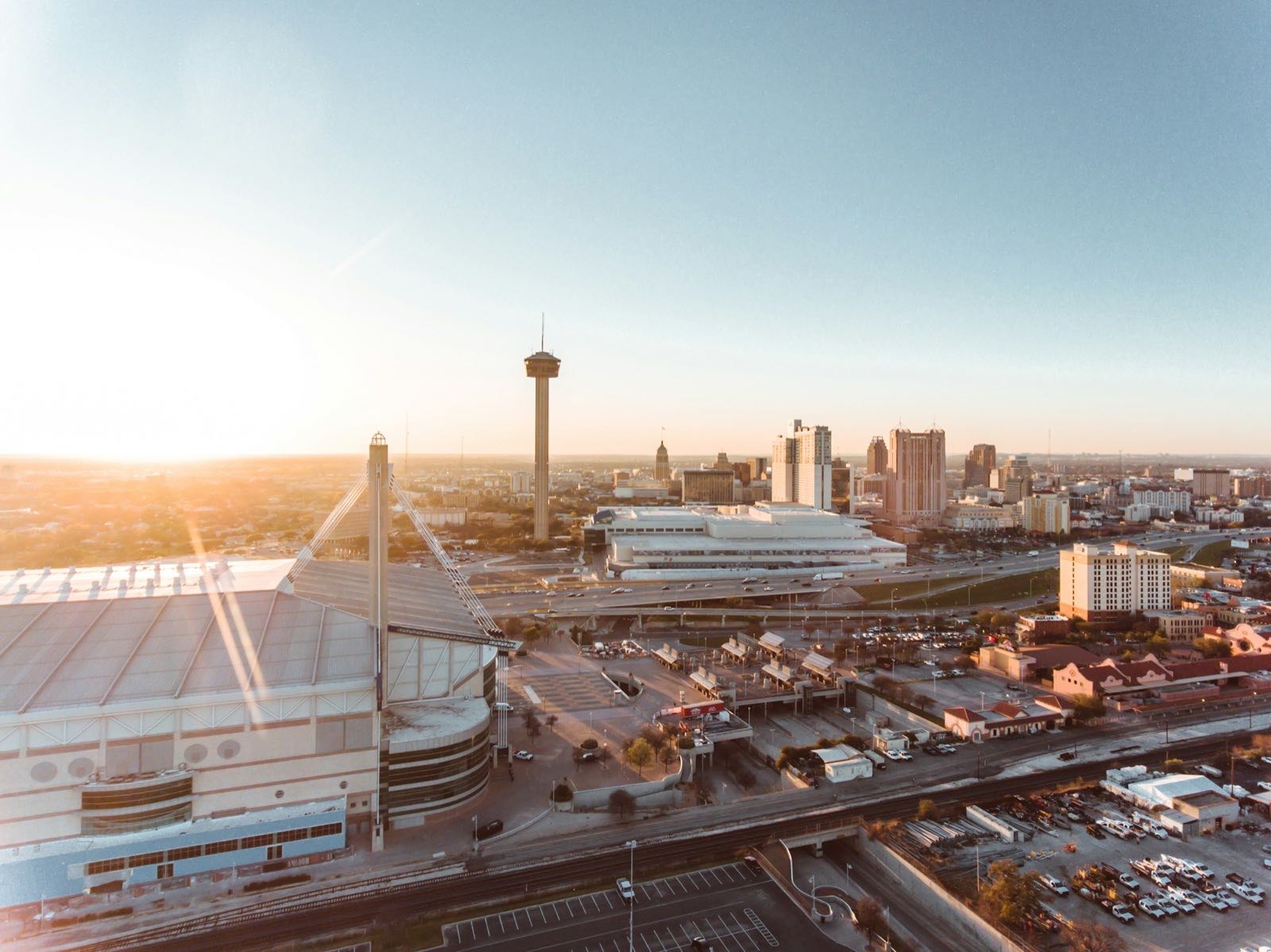 San Antonio at sunset with the Tower of the Americas and Alamodome