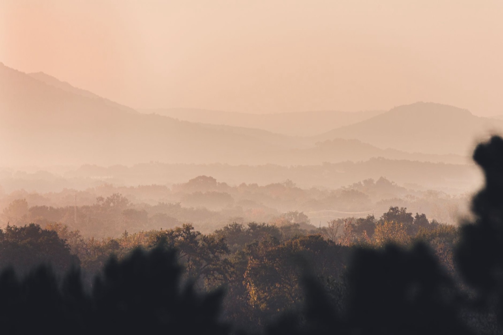 Hill Country ridgelines fading into morning haze