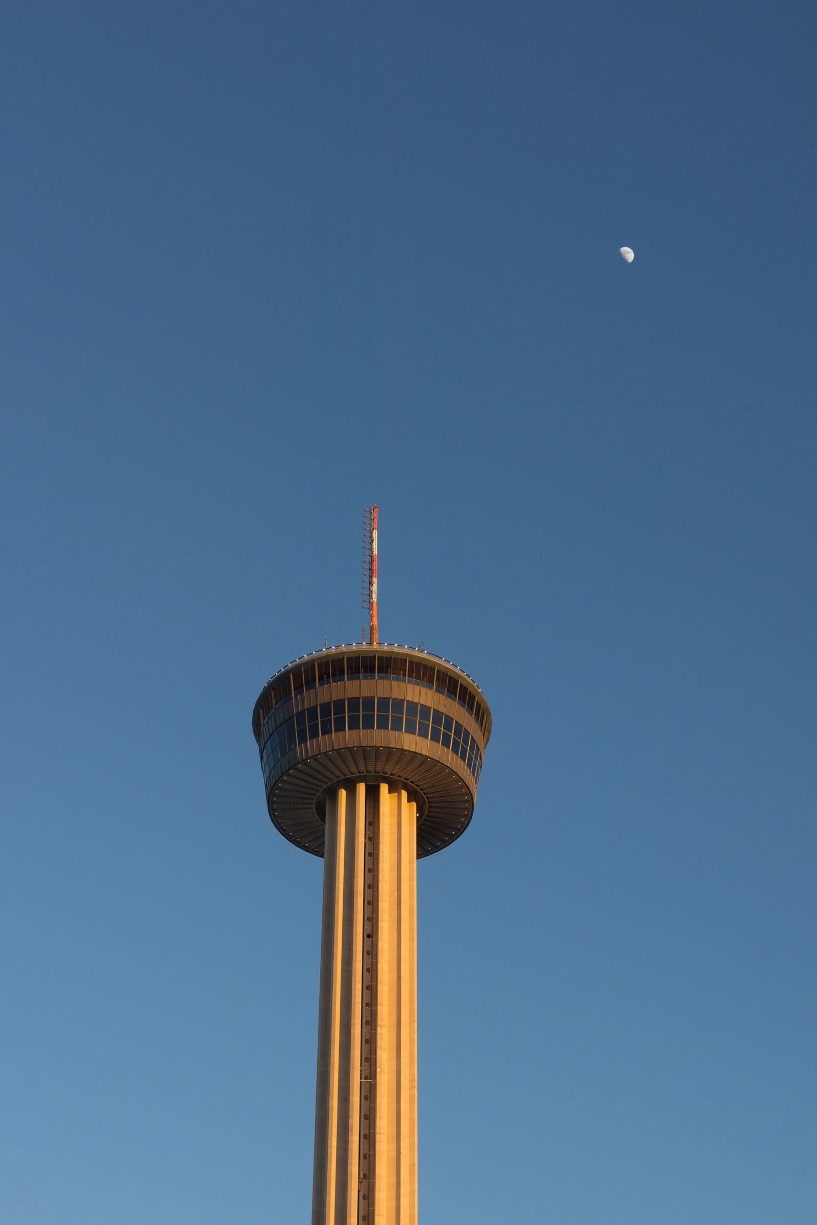 Top of the Tower of the Americas against a clear blue sky